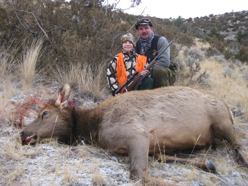 Young hunter with large elk